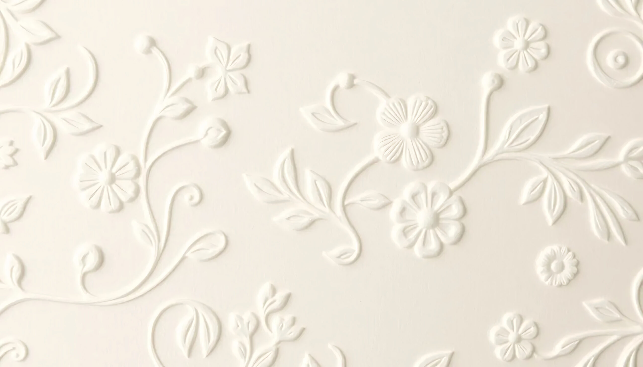 classic embossed floral pattern in off white with raised damask design